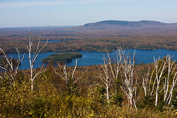 On top of Big Tupper at the summit of Big Tupper looking down at Tupper Lake tupper lake stock pictures, royalty-free photos & images
