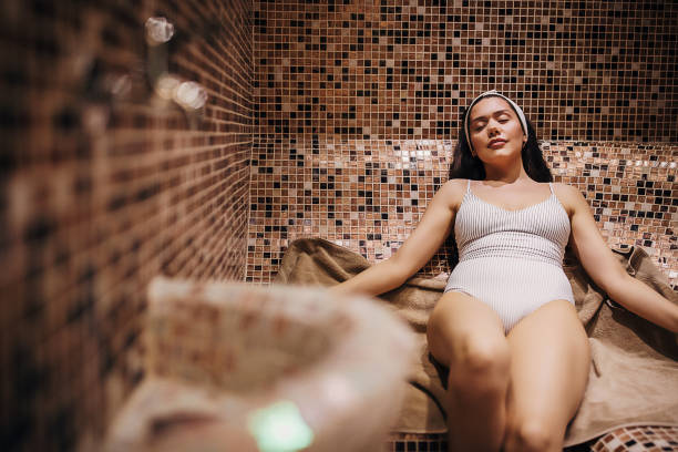 One attractive young woman relaxing in the steam room Beautiful young woman relaxing in the steam room at the spa center. hot turkish women stock pictures, royalty-free photos & images