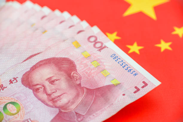 One hundred Chinese yuan bill with a flag of China. stock photo