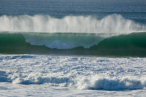 One ocean wave breaking stock photo