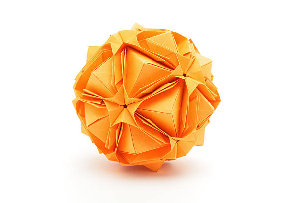 un arancione origami carta arte design poliedro - origami foto e immagini stock