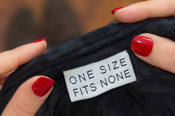 one size fits none label Pov woman reading one size fits none label oversized object stock pictures, royalty-free photos & images