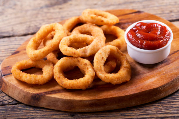 onion rings with ketchup stock photo