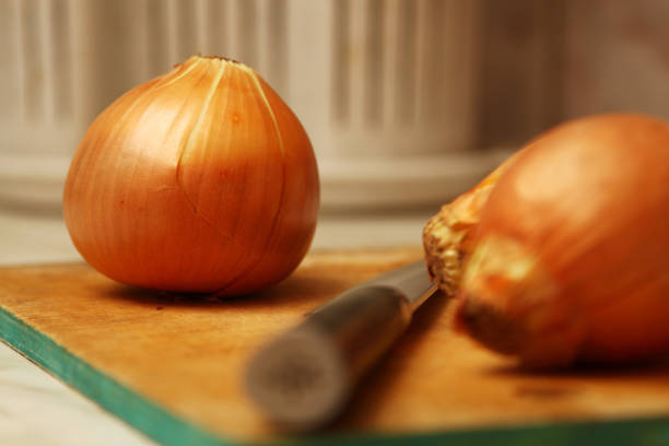 Onions on the kitchen table. stock photo