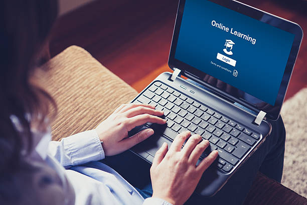 "Online Learning" on the screen. Woman hands over the laptop keyboard. online computer science degree stock pictures, royalty-free photos & images