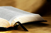istock Open Bible on Gold Background 165888125