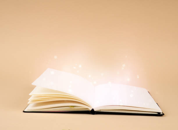 Open book on blue background, open pages as a concept of new knowledge, online self-study stock photo
