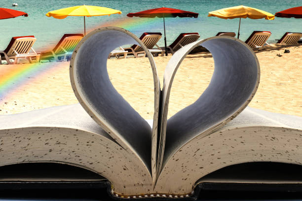 Open book with heart curve with beach view stock photo