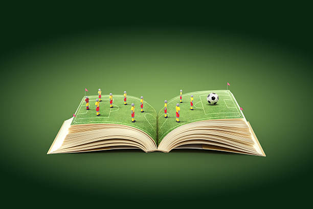 open book with soccer field as the pages - soccer news 個照片及圖片檔