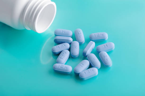 Open bottle of prescription PrEP Pills for Pre-Exposure Prophylaxis to help protect people from HIV. stock photo