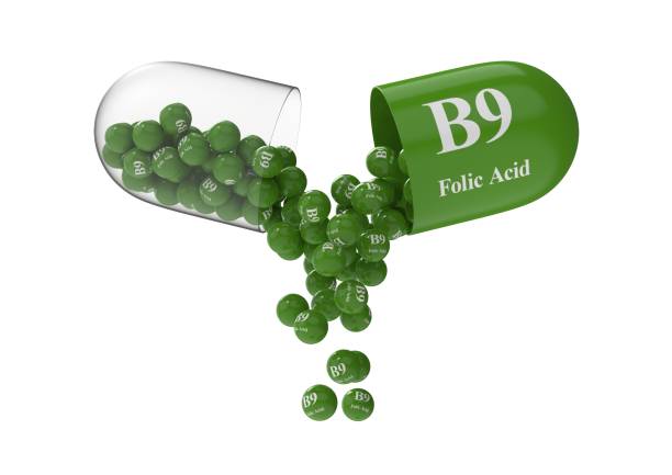 Open capsule with folic acid from which the vitamin composition is pouring Open capsule with b9 folic acid from which the vitamin composition is poured. Medical 3D rendering illustration folic acid stock pictures, royalty-free photos & images