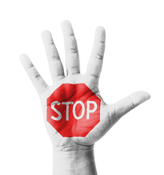 Open hand raised, STOP sign painted Open hand raised, STOP sign painted, multi purpose concept - isolated on white background stop gesture stock pictures, royalty-free photos & images
