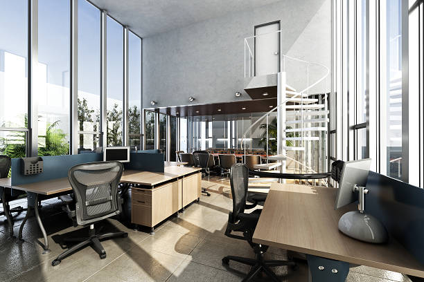 Open interior furnished modern office with large ceilings and windows stock photo