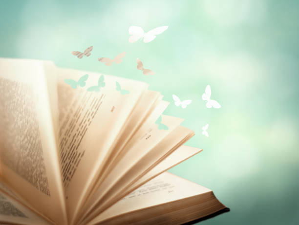 Open magic book with magic paper butterflies fly from it Open pages old magic book with  paper butterflies ho departing from the pages on a green romantic background. Romantic dreamy artistic image of a fairytale. romance book cover stock pictures, royalty-free photos & images
