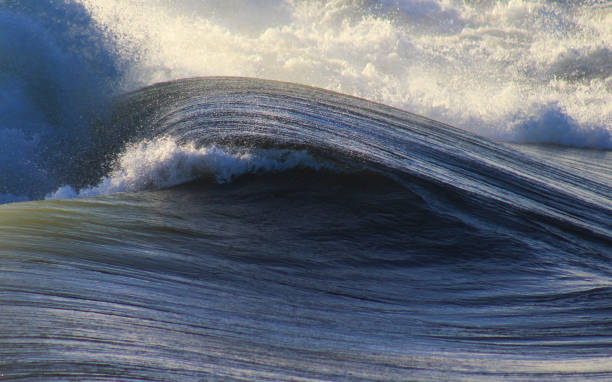 open ocean breaking wave stock photo