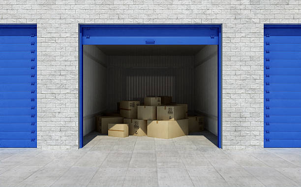 Open self storage unit full of cardboard boxes. 3d rendering Open self storage unit full of cardboard boxes. 3d rendering self storage stock pictures, royalty-free photos & images