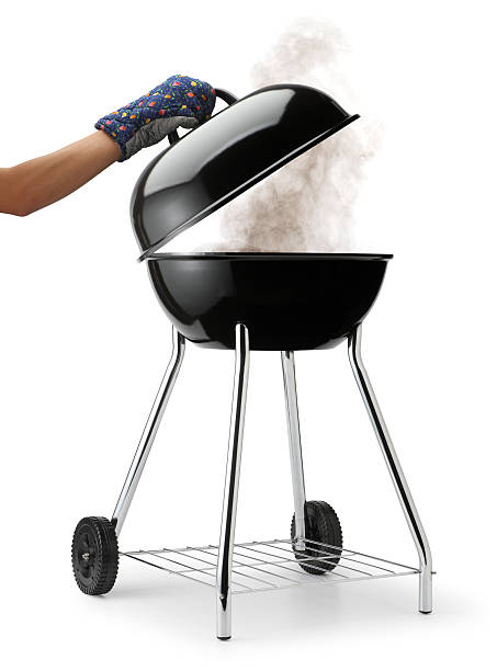 Opening Barbecue Grill with Smoke stock photo