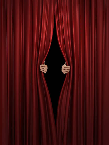 opening red stage curtain stock photo