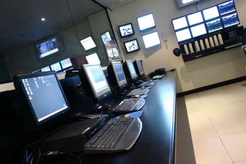 A row of terminals and monitors in an Operations Data Centre.