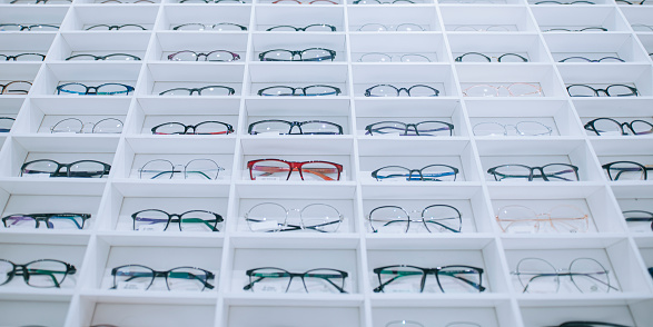 optical shop with variety of eyeglasses frame displayed on shelf