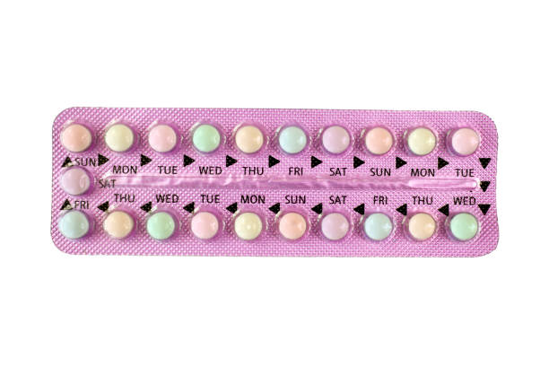 Oral contraceptive pill strips isolated on white background with clipping path. Colorful oral contraceptive pill in purple strip. isolated on white background with clipping path. birth control pill stock pictures, royalty-free photos & images