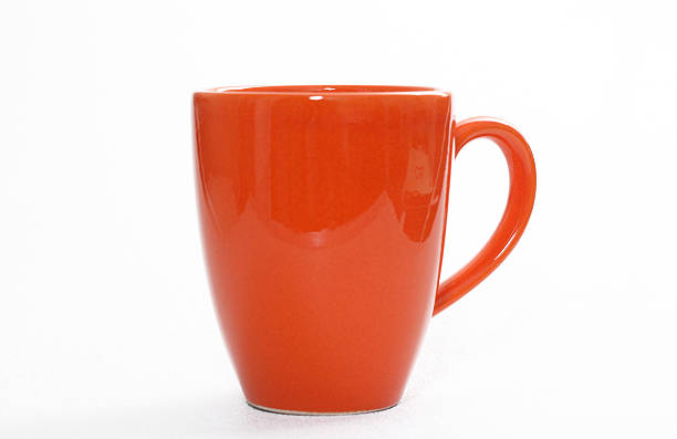 Orange Coffee Cup on White Background - Closeup  mug stock pictures, royalty-free photos & images