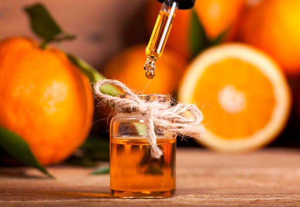 orange essential oil - essential oils smell stockfoto's en -beelden
