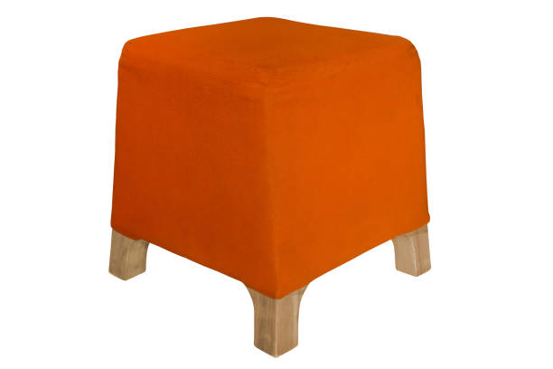 Orange fabric padded low stool isolated on white background stock photo