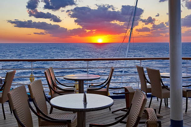 Orange Glow Sunset from the Cruise Ship Dining Deck stock photo