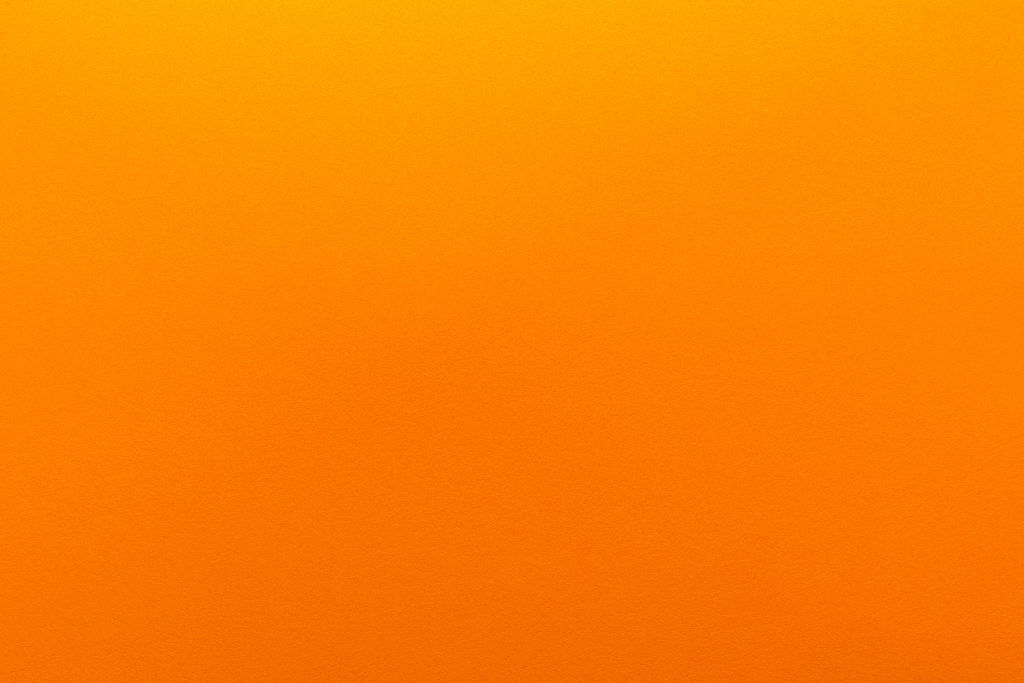 Orange gradient color with texture from real foam sponge paper for background, backdrop or design.