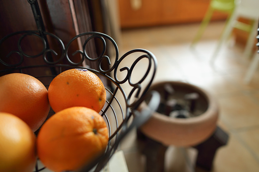 Orange in the kitchen with coal stove