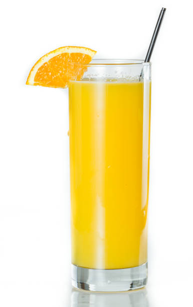 Orange Juice and vodka - srevewdriver closeup of a glass filled with fresh orange juice isolated on a white background screwdriver drink stock pictures, royalty-free photos & images