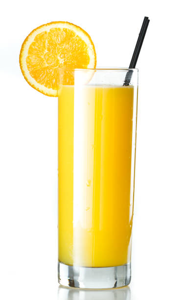 Orange Juice and vodka - srevewdriver closeup of a glass filled with fresh orange juice isolated on a white background screwdriver drink stock pictures, royalty-free photos & images