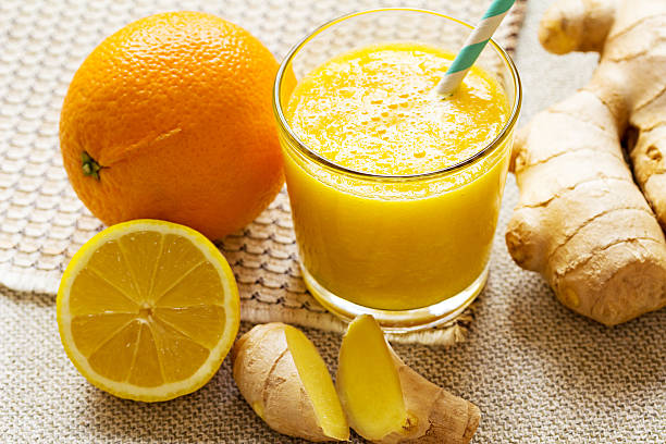 Orange, lemon, ginger smoothies. Orange, lemon, ginger smoothies. Vegan energy smoothie. orange smoothie stock pictures, royalty-free photos & images