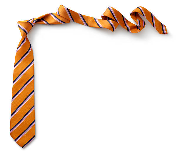 Orange necktie with black, purple and white stripes  Necktie on white background. necktie stock pictures, royalty-free photos & images