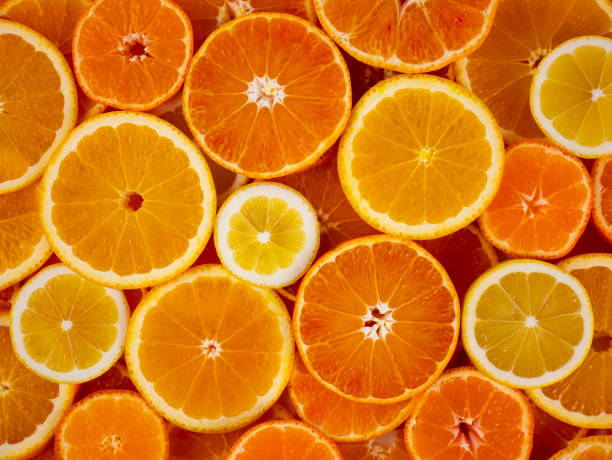 Orange slices background. Citrus fruits. stock photo
