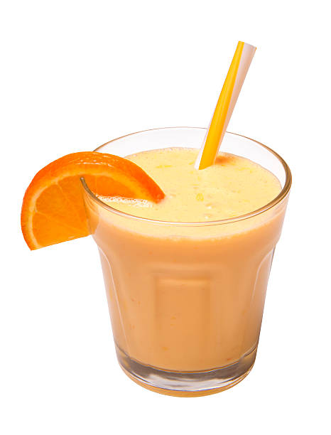 orange smoothie isolated cool orange smoothie with straw in a glass isolated on white background orange smoothie stock pictures, royalty-free photos & images