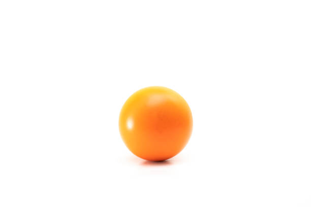 orange stress ball isolated on white background stock photo