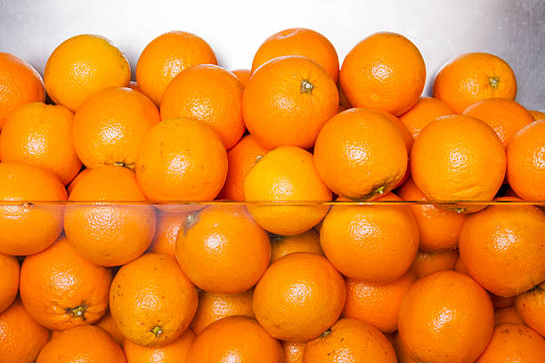 Oranges bunch public exposure oranges, Mediterranean breakfast is based on a balanced diet where Orange is essential to absorb vitamin C parque museo la venta stock pictures, royalty-free photos & images