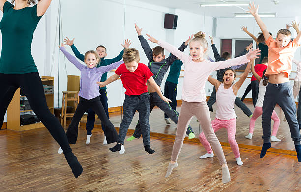 ordinary boys and girls studying contemp dance - kids dancing bildbanksfoton och bilder