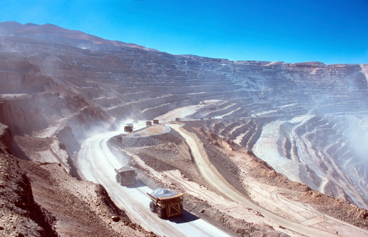 Ore trucks in an open-pit mine. Calama, Atacama desert. North Chile