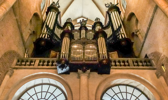 church organ pipes sit at one end of the church interior and surround the oran itself.