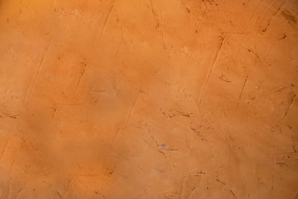 Organgish rough stucco mud grunge background where you can see the marks where it been applied  adobe backgrounds stock pictures, royalty-free photos & images
