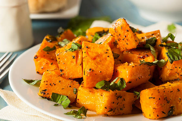 Organic Baked Butternut Squash Organic Baked Butternut Squash with Herbs and Spices squash vegetable stock pictures, royalty-free photos & images