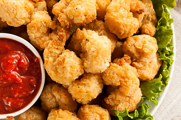 Organic Breaded Popcorn Shrimp Organic Breaded Popcorn Shrimp with Cocktail Sauce cocktail sauce stock pictures, royalty-free photos & images