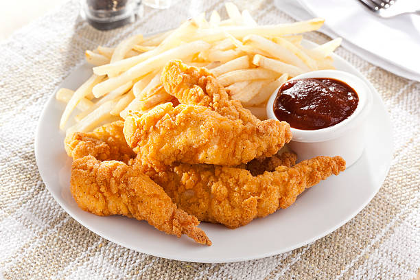 Organic Crispy Chicken Strips Organic Crispy Chicken Strips on a background affectionate stock pictures, royalty-free photos & images