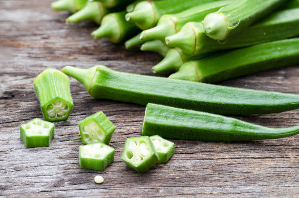 Organic food, Sliced fresh green okra  on wood backgroud. Organic food, Sliced fresh green okra  on wood backgroud. okra photos stock pictures, royalty-free photos & images