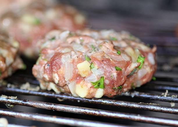Organic Hamburger on Barbecue Grill stock photo