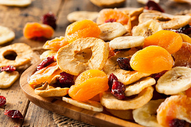 Organic Healthy Assorted Dried Fruit Organic Healthy Assorted Dried Fruit on a Plate dried food photos stock pictures, royalty-free photos & images