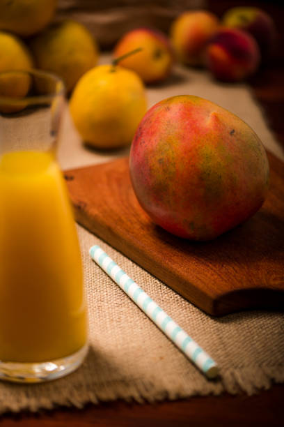 Organic Juice of Mango, Peach and Orange. stock photo